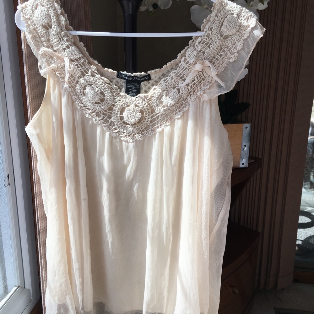 Sleeveless, knitted and flowy.